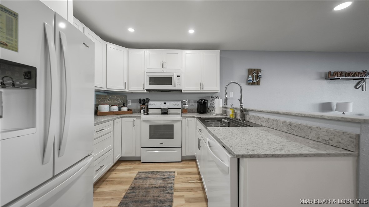 1481 Ledges Drive, Unit 1019 Osage Beach, MO 65065 - Photo 11 of 52 Modern design with panoramic lakefront glass slide