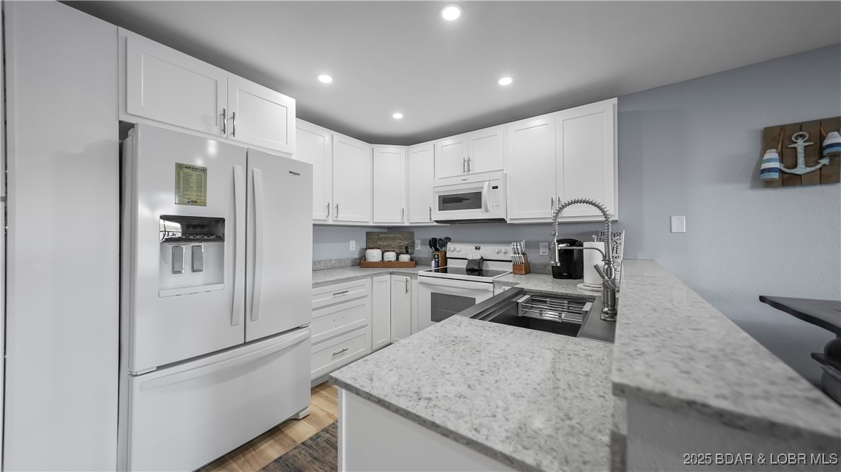 1481 Ledges Drive, Unit 1019 Osage Beach, MO 65065 - Photo 10 of 52 Modern design with panoramic lakefront glass slide