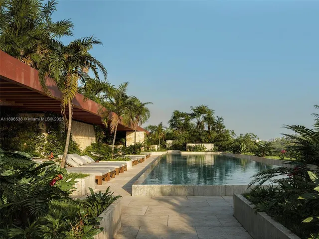 a swimming pool with outdoor seating and yard