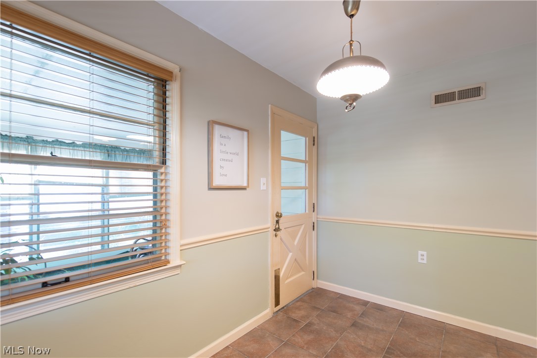 193 Sand Run Road Akron, OH 44313 - Photo 13 of 35 Eat-in area leads to an enclosed sunroom