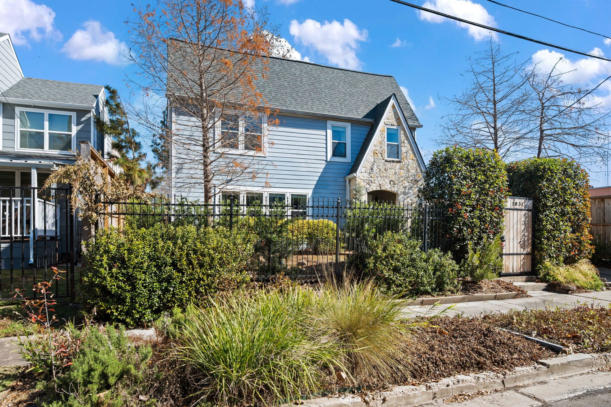 1831 Palm Street Houston, TX 77004 - Photo 1 of 27 Welcome to 1831 Palm Street! Charming two-story home with a stone and blue siding exterior, in the heart of Houston's Museum District.