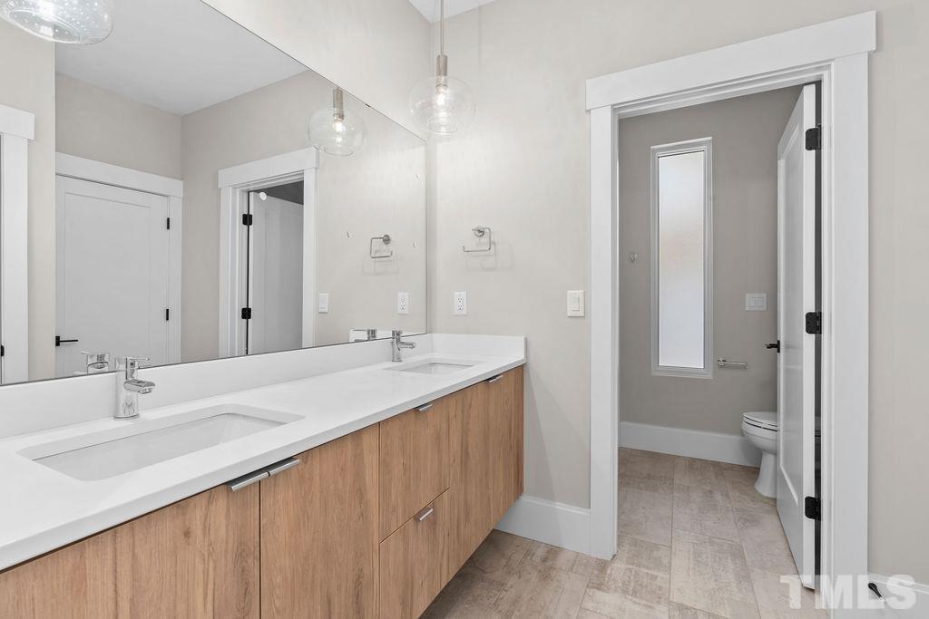 1623 Nottingham Road Raleigh, NC 27607 - Photo 19 of 29 a bathroom with a sink and a mirror