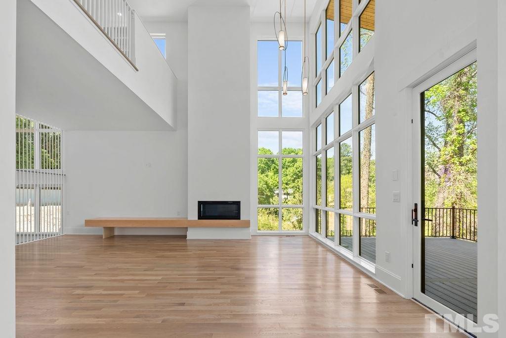 1623 Nottingham Road Raleigh, NC 27607 - Photo 6 of 29 a view of empty room with wooden floor and fan
