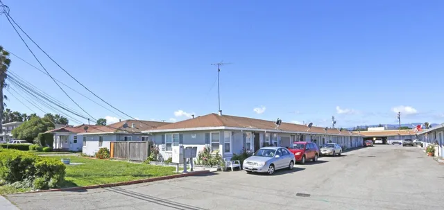 a view of a car park in front of house