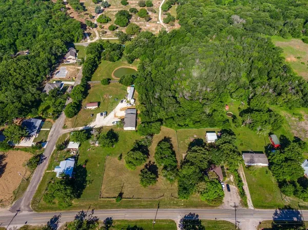 an aerial view of residential house with outdoor space and swimming pool