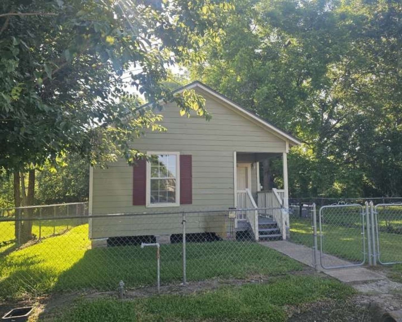 4520 Falls Street Houston, TX 77026 - Photo 1 of 11 a view of a house with backyard and a tree