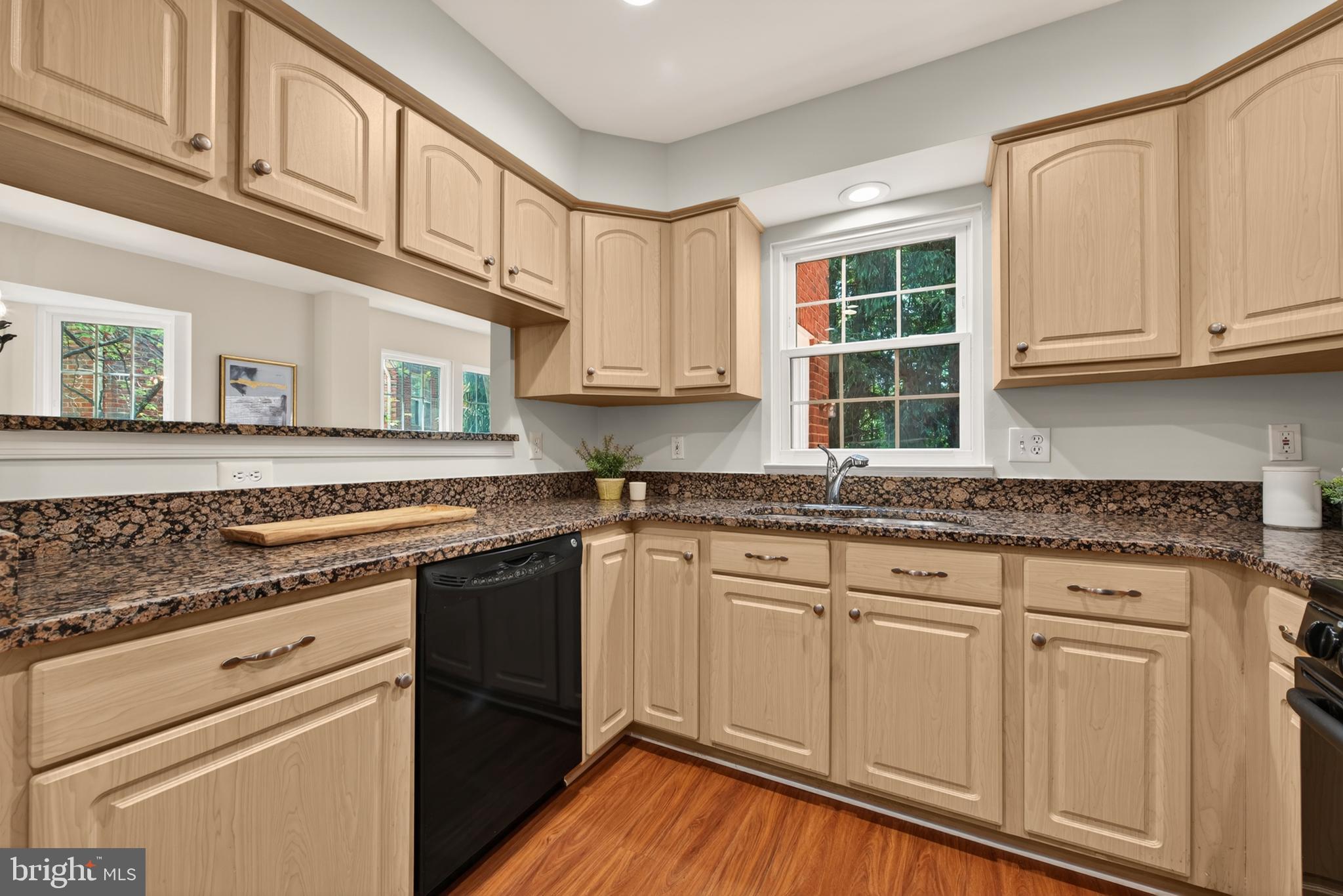 1409 Park Garden Lane Reston, VA 20194 - Photo 16 of 41 a kitchen with granite countertop cabinets stainless steel appliances and a sink