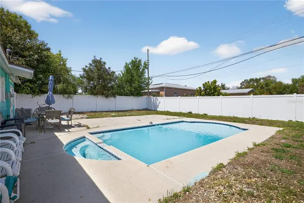 a view of a swimming pool with a patio