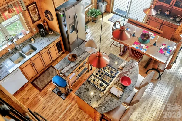 a bathroom with a granite countertop double vanity sink and a mirror