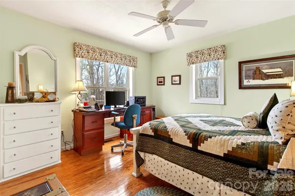a bathroom with double sink and a mirror