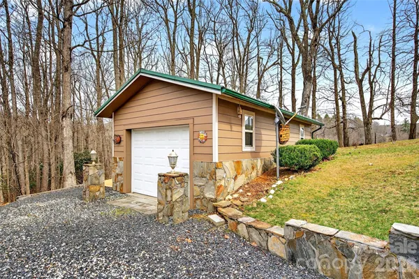 a view of an empty room with a wooden fence