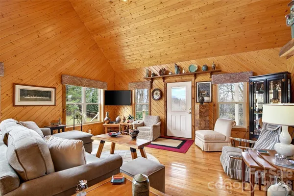a outdoor living space with furniture and a floor to ceiling window