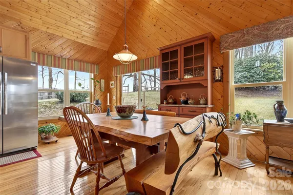 a view of a dining room with furniture window and outside view