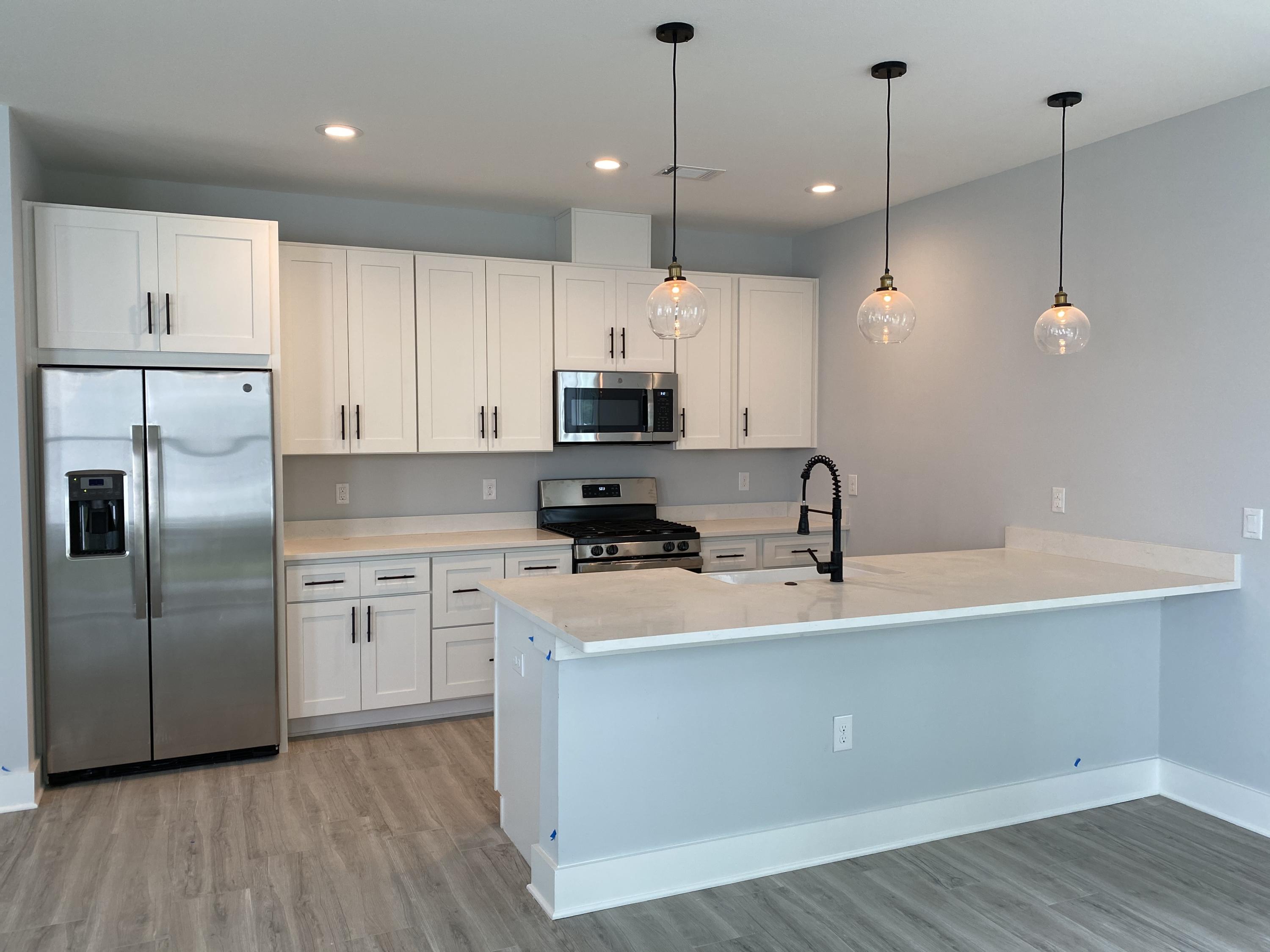 Lot #16 Lighthouse Pointe Boulevard Santa Rosa Beach, FL 32459 - Photo 3 of 23 a kitchen with kitchen island a counter space a sink appliances and cabinets