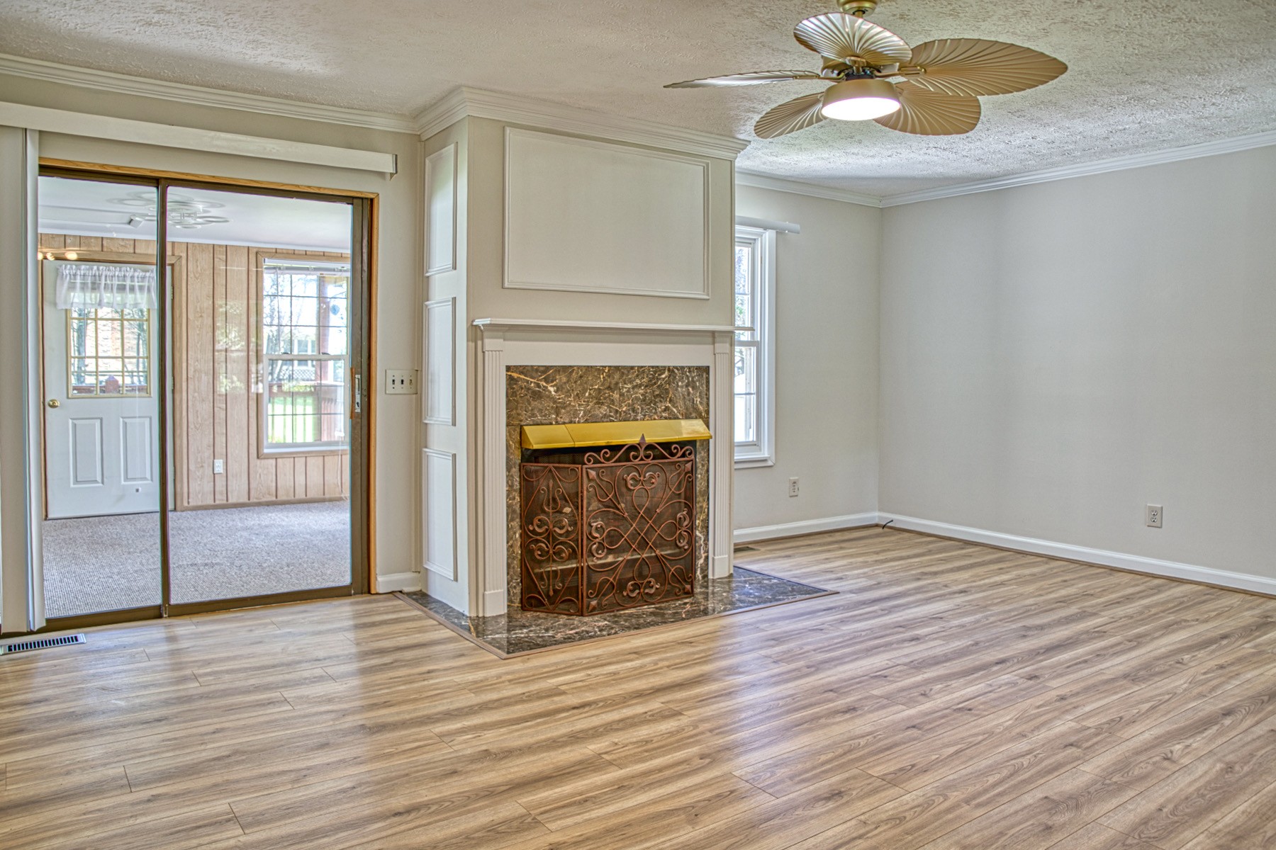 2085 Herbert Garrett Road Cookeville, TN 38506 - Photo 10 of 39 a view of an empty room with wooden floor and a window