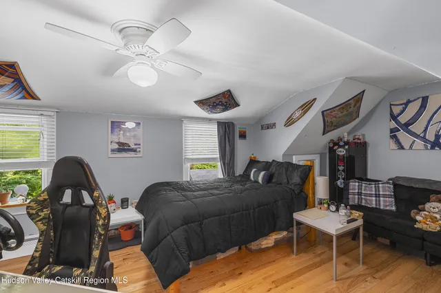 a bedroom with furniture and a window