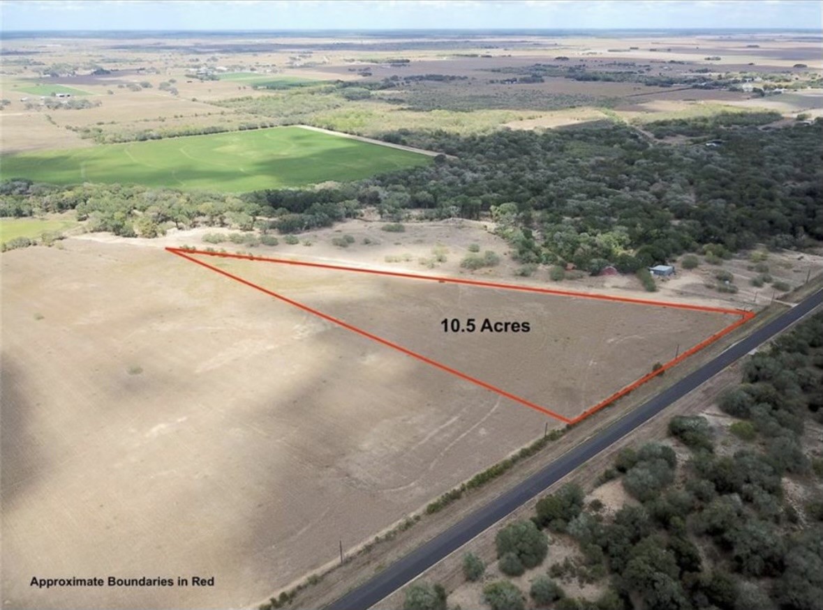 a view of a field and an ocean view