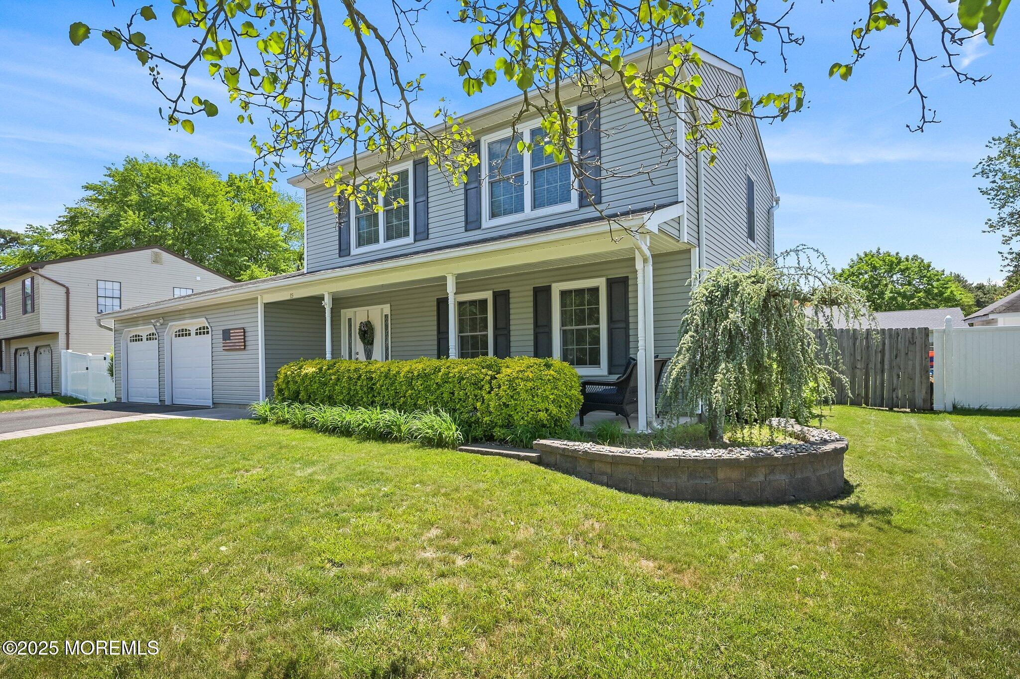 15 Peachstone Road Howell, NJ 07731 - Photo 2 of 2 a front view of a house with a garden