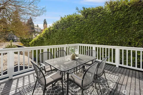 a view of a wooden deck and outdoor seating