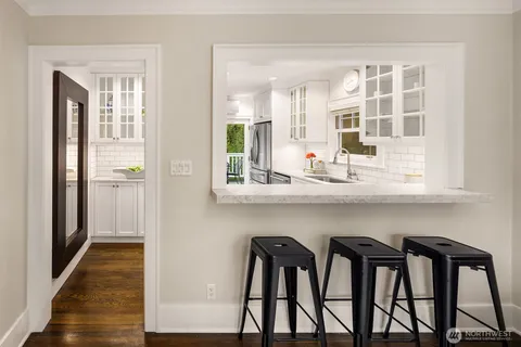 a kitchen with a table and chairs