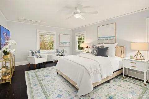 a bedroom with a bed and a couch