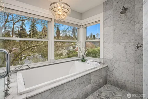 a bathroom with a bathtub and a shower