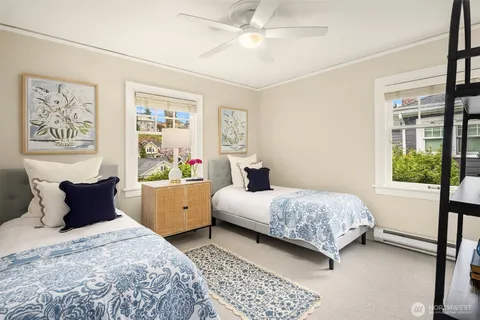 a bedroom with a large bed and a window