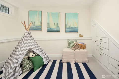 a living room with furniture and a rug