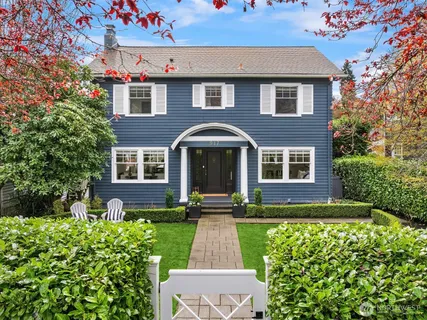 a front view of a house with garden