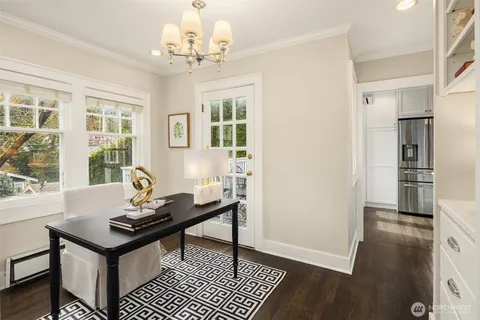 a view of a dining room with furniture window and wooden floor