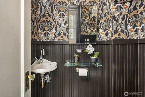 a bathroom with a sink and mirror