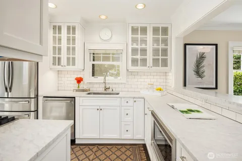 a kitchen with a sink stove and refrigerator