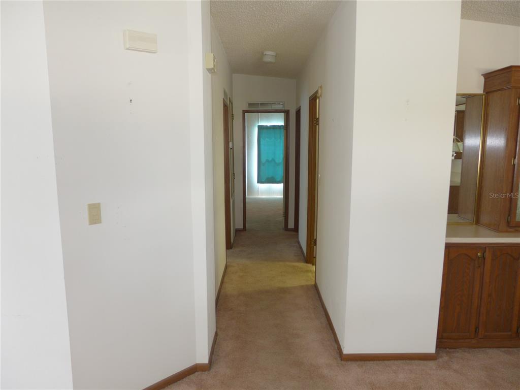 432 Santa Fe Road Tavares, FL 32778 - Photo 14 of 41 a view of a hallway with wooden floor