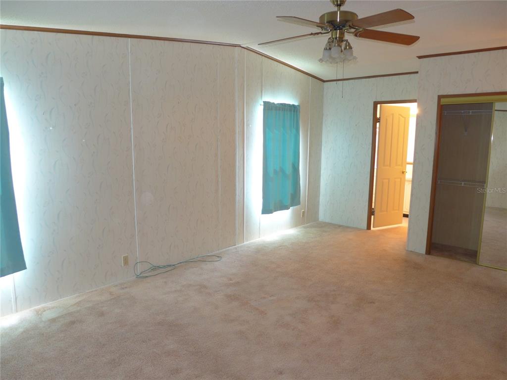 432 Santa Fe Road Tavares, FL 32778 - Photo 18 of 41 a view of an empty room with a window