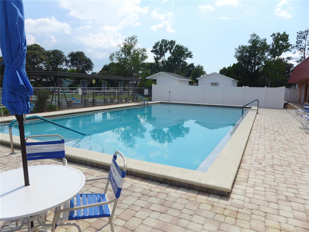 432 Santa Fe Road Tavares, FL 32778 - Photo 34 of 41 a view of a swimming pool with a patio