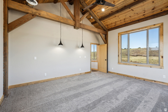 46997 West Thunder Road Fruitland, UT 84027 - Photo 32 of 49 Carpeted spare room featuring a wooden ceiling with exposed beams, high vaulted ceiling, and a ceiling fan
