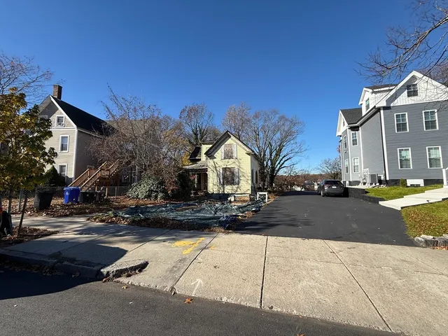 a view of a street with houses