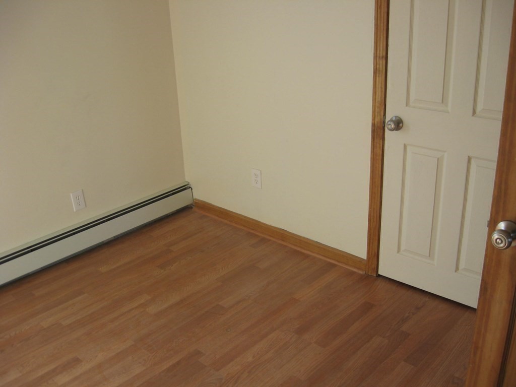 607 South Main Street Fall River, MA 02721 - Photo 11 of 24 a view of empty room with wooden floor