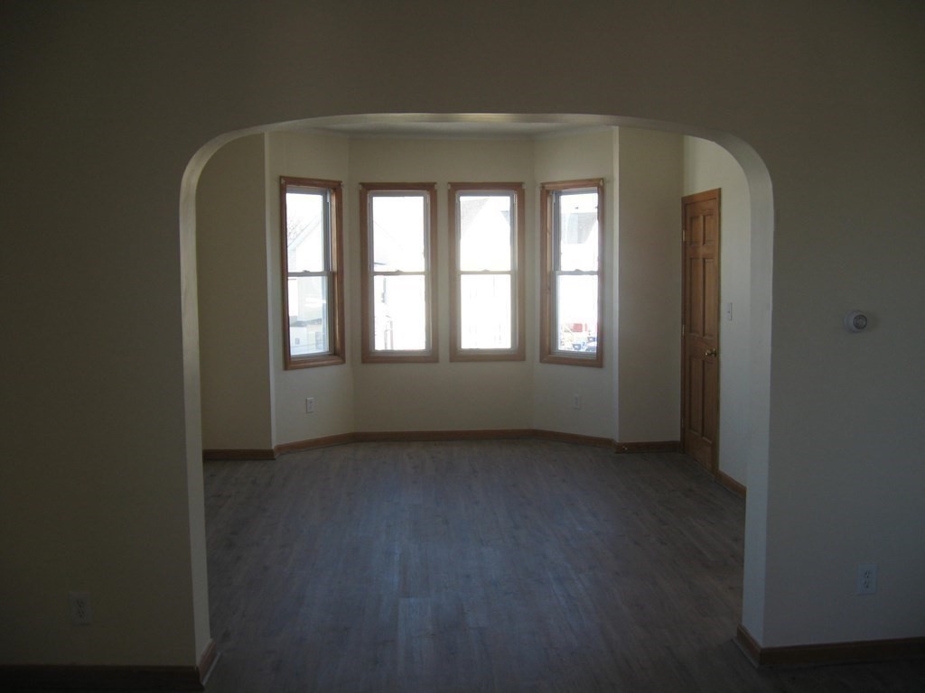 607 South Main Street Fall River, MA 02721 - Photo 9 of 24 a view of an empty room with a window