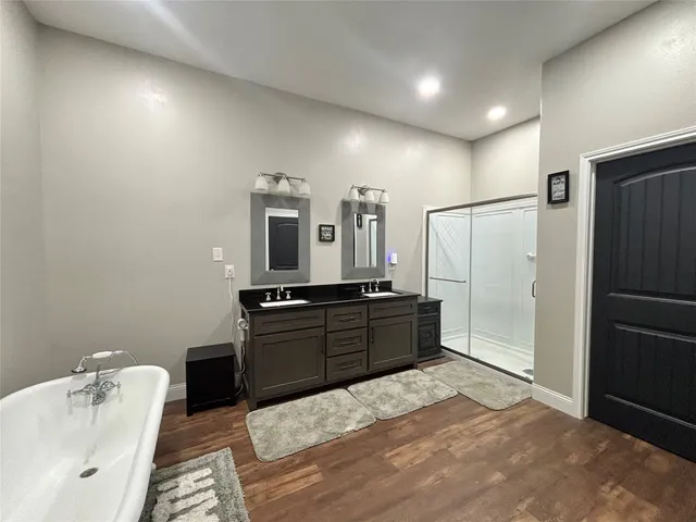 a room with a bed and a dresser