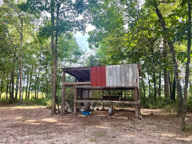 a view of house with outdoor seating area