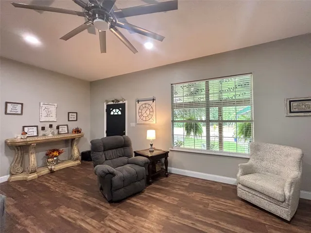 a living room with furniture and a window