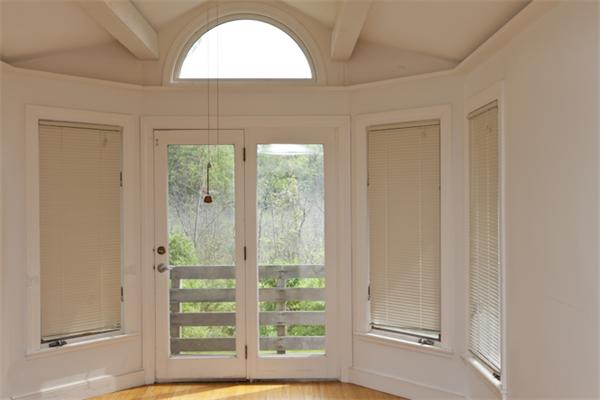 57 Concord Road Wayland, MA 01778 - Photo 6 of 10 a view of a room with a large window and front door