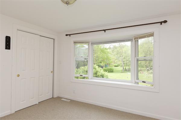 57 Concord Road Wayland, MA 01778 - Photo 7 of 10 a view of an empty room with a window