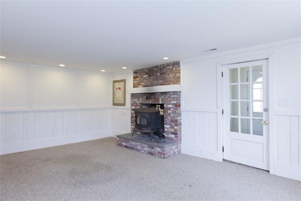 57 Concord Road Wayland, MA 01778 - Photo 8 of 10 a view of empty room with a fireplace