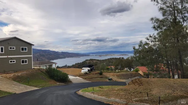 a view of a field with an trees