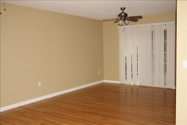 167 Wrentham Road Springfield, MA 01119 - Photo 4 of 7 a view of an empty room with wooden floor
