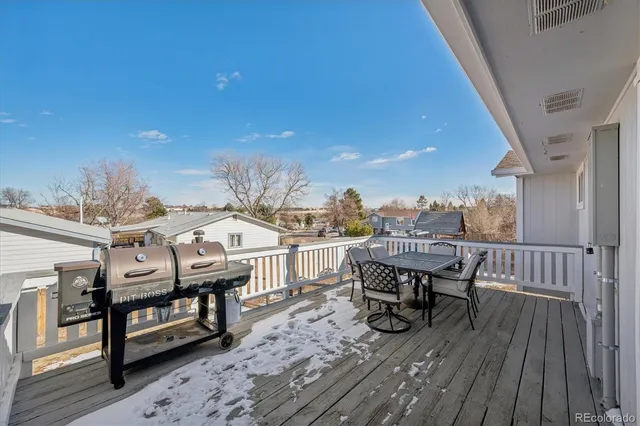 a view of a terrace with seating area