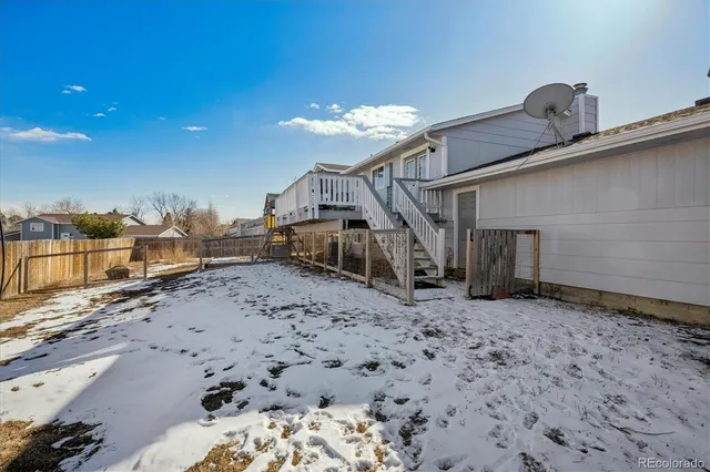 a view of a dirt road and a building