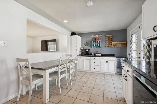 a kitchen with stainless steel appliances a stove refrigerator sink and cabinets